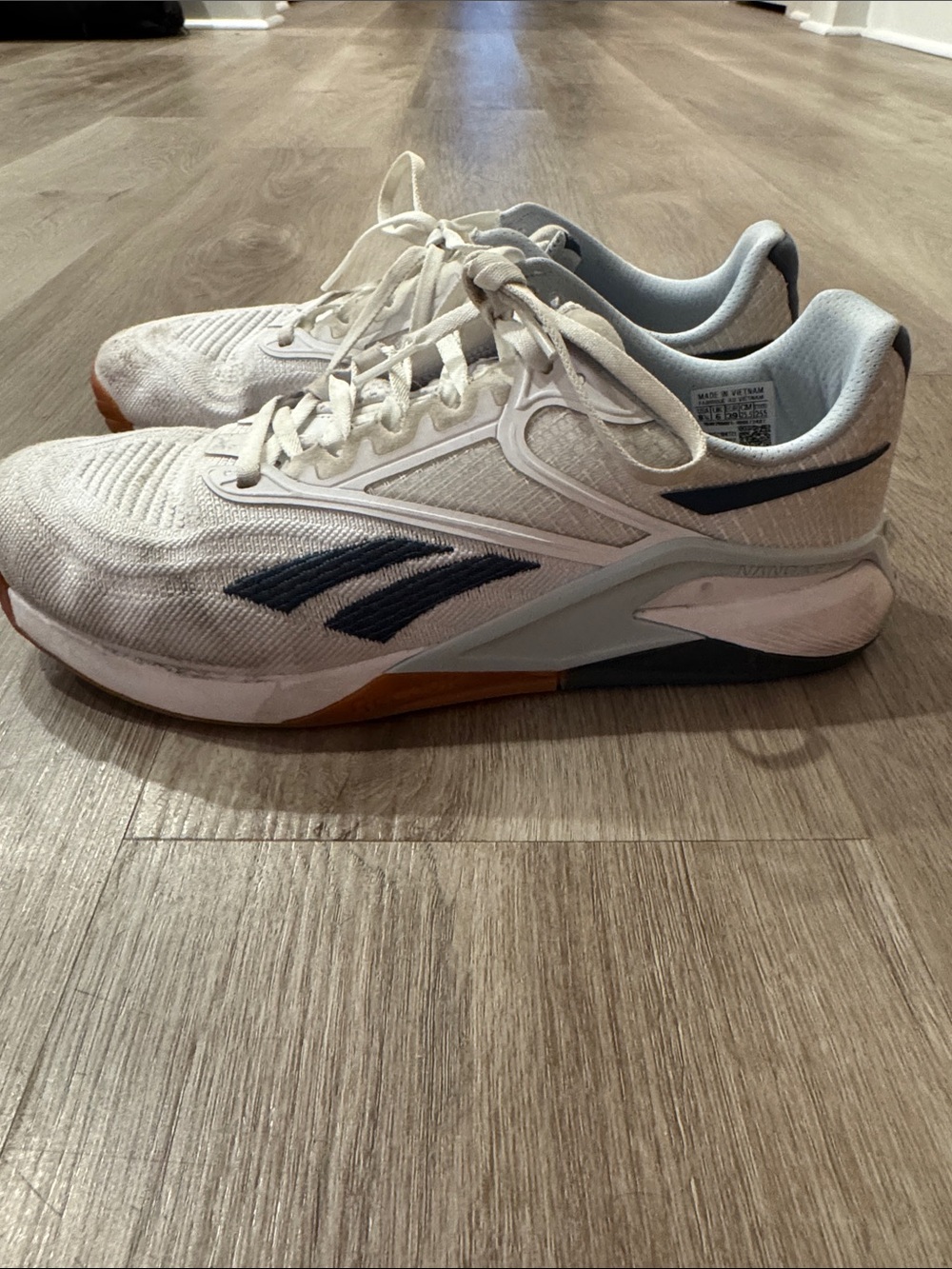 Reebok Women’s White Athletic Sneakers with Navy Accents
